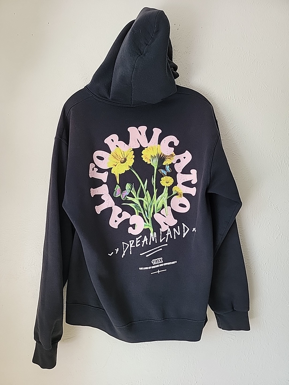 Y2k PacSun Black Hoodie with Pink Lettering and Yellow Floral Graphic